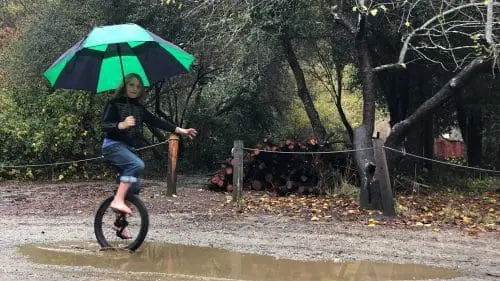 girl-on-unicycle-orchard