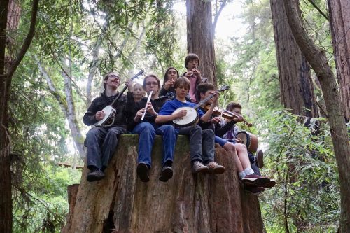 community-music-school-teens-on-a-tree